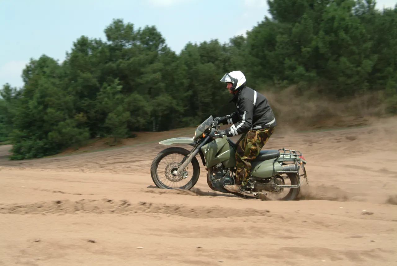 Orange KTM enduro motorcycle on a stand