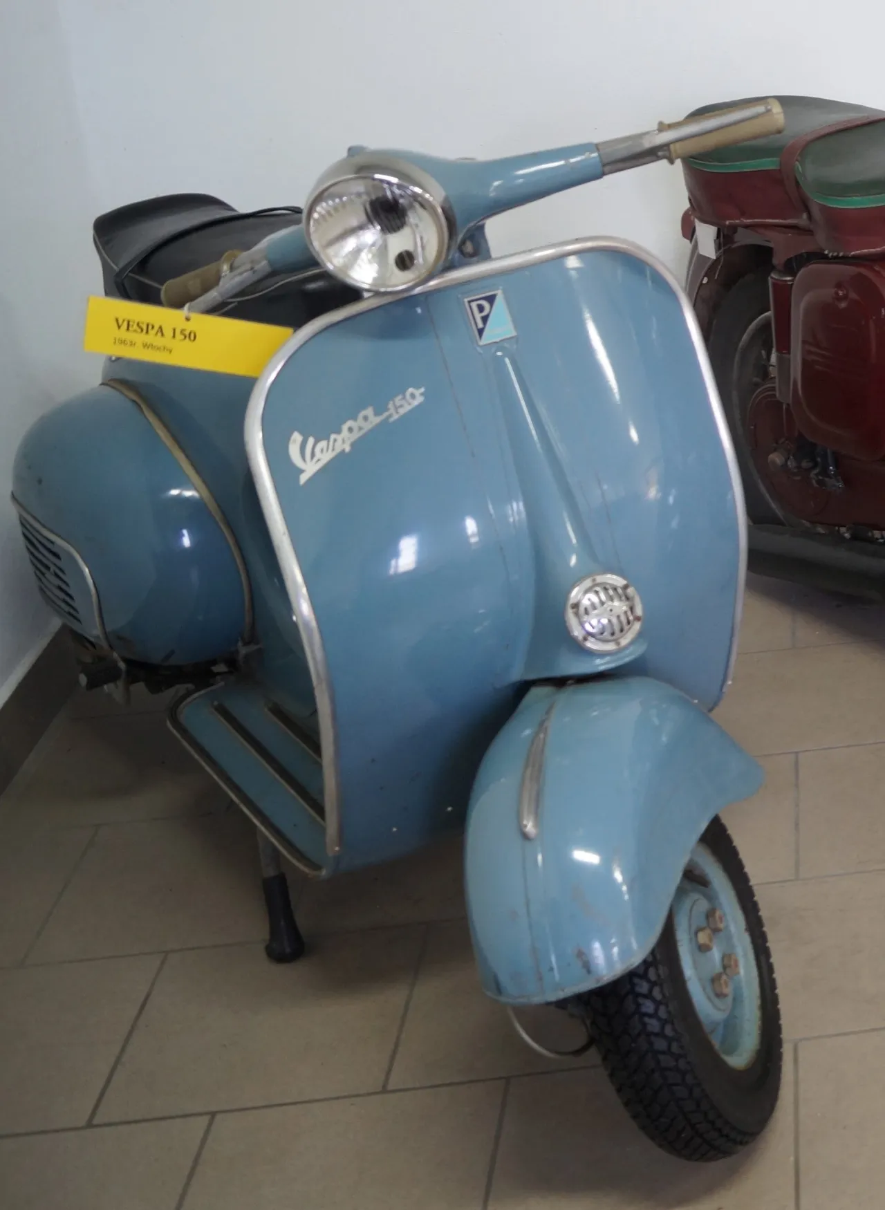 Piaggio Vespa 150 scooter on display in a museum
